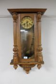 A continental oak cased eight day wall clock