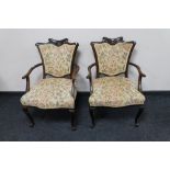 A pair of Edwardian mahogany armchairs