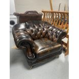 A brown buttoned leather Thomas Lloyd armchair