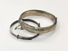 Two silver bangles. (2) CONDITION REPORT: 27g gross.