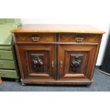 A nineteenth century walnut two drawer side cabinet