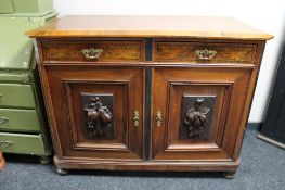 A nineteenth century walnut two drawer side cabinet
