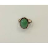 A gold and jade ring, size N1/2. CONDITION REPORT: 9ct gold. 4.2g.