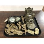 A tray of gilt plaster cherub figures, Player's Airman tobacco tins,
