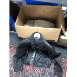 A box of gent's black leather jacket and quantity of twentieth century table linen