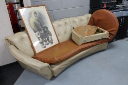 A mid century curved buttoned back settee