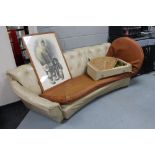 A mid century curved buttoned back settee