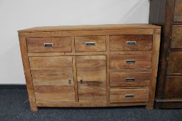 A sheesham wood multi drawer sideboard