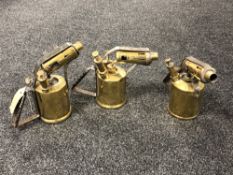 Three antique brass blow torches