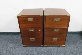 A pair of mahogany brass cornered three drawer chests