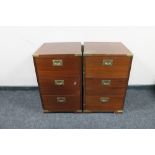 A pair of mahogany brass cornered three drawer chests