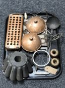 A tray of antique metal ware and kitchenalia, jelly mould,