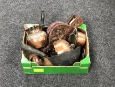 A box of antique copper ware, cast iron kitchen sieve, old gin trap,