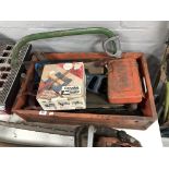 A plastic storage box containing saws, joint master,