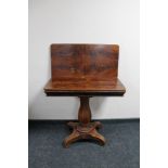 A nineteenth century mahogany turn over topped tea table