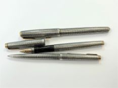 A Parker Sonnet silver ball point pen and a Parker USA silver fountain pen with 14ct gold nib and