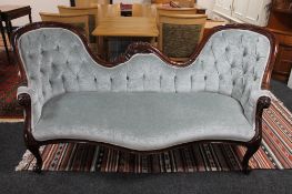 A Victorian style camel backed settee