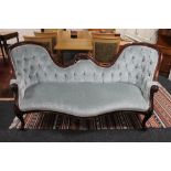 A Victorian style camel backed settee