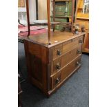 An antique oak three drawer chest