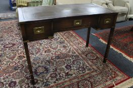 An early twentieth century mahogany leather topped desk