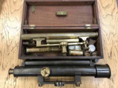 An antique brass theodolite together with a further brass theodolite by Troughton and Simms London.