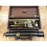 An antique brass theodolite together with a further brass theodolite by Troughton and Simms London.