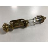 A vintage brass GWR wall mounted oil lamp