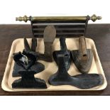 A tray of cast iron door stop, vintage irons, cobblers last,