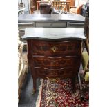 A continental inlaid walnut bombe style marble topped three drawer chest