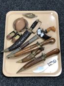 A tray of 20th century Malaysian Kris knife in sheath, other knives in sheathes,
