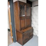 An oak linen fold bureau bookcase