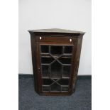 An Edwardian stained pine corner cabinet