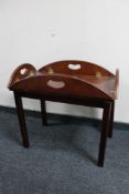 A mahogany butler's tray on stand