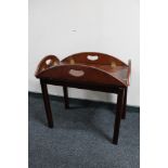 A mahogany butler's tray on stand