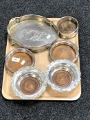 A tray of two pairs of silver plated wine coasters,