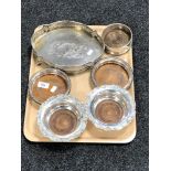 A tray of two pairs of silver plated wine coasters,