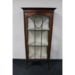 An Edwardian inlaid mahogany display cabinet