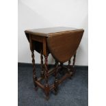 An oak gateleg table