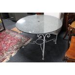 A granite topped metal garden table,