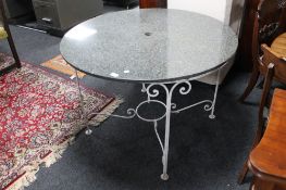 A granite topped metal garden table,