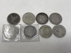 Eight silver USA dollars