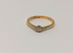 An 18ct gold platinum set diamond solitaire ring, size K/L, 2.2g.