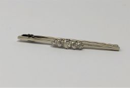 An 18ct gold and platinum five stone diamond brooch, approximately 0.9ct, 5.2g.
