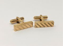 A pair of 9ct gold rectangular textured cufflinks, 6.2g.