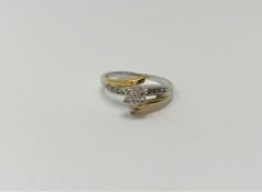 A yellow and white gold diamond set ring,