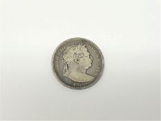 An 1816 Bull head half crown