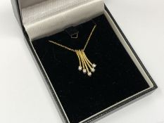A 10ct gold diamond set pendant on chain