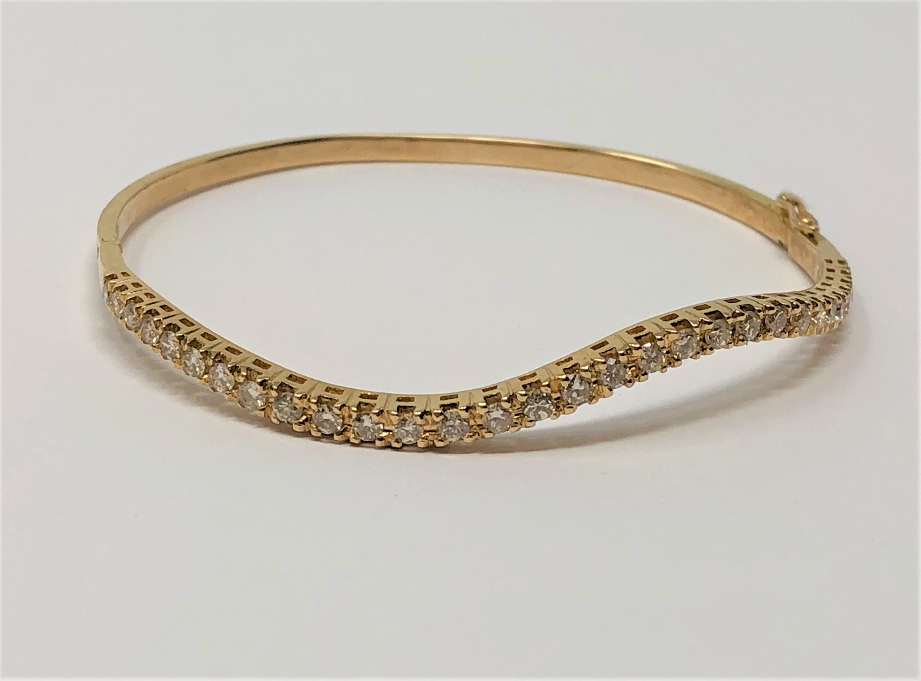 An 18ct gold bangle set with 30 diamonds, approximately 1.2ct, 8.8g. - Image 2 of 2