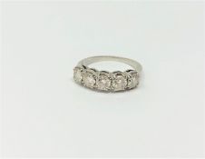 A platinum five stone diamond ring, size M/N, approximately 1.25ct, 5.2g.