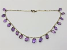 A fine antique amethyst and pearl necklace with gold fittings